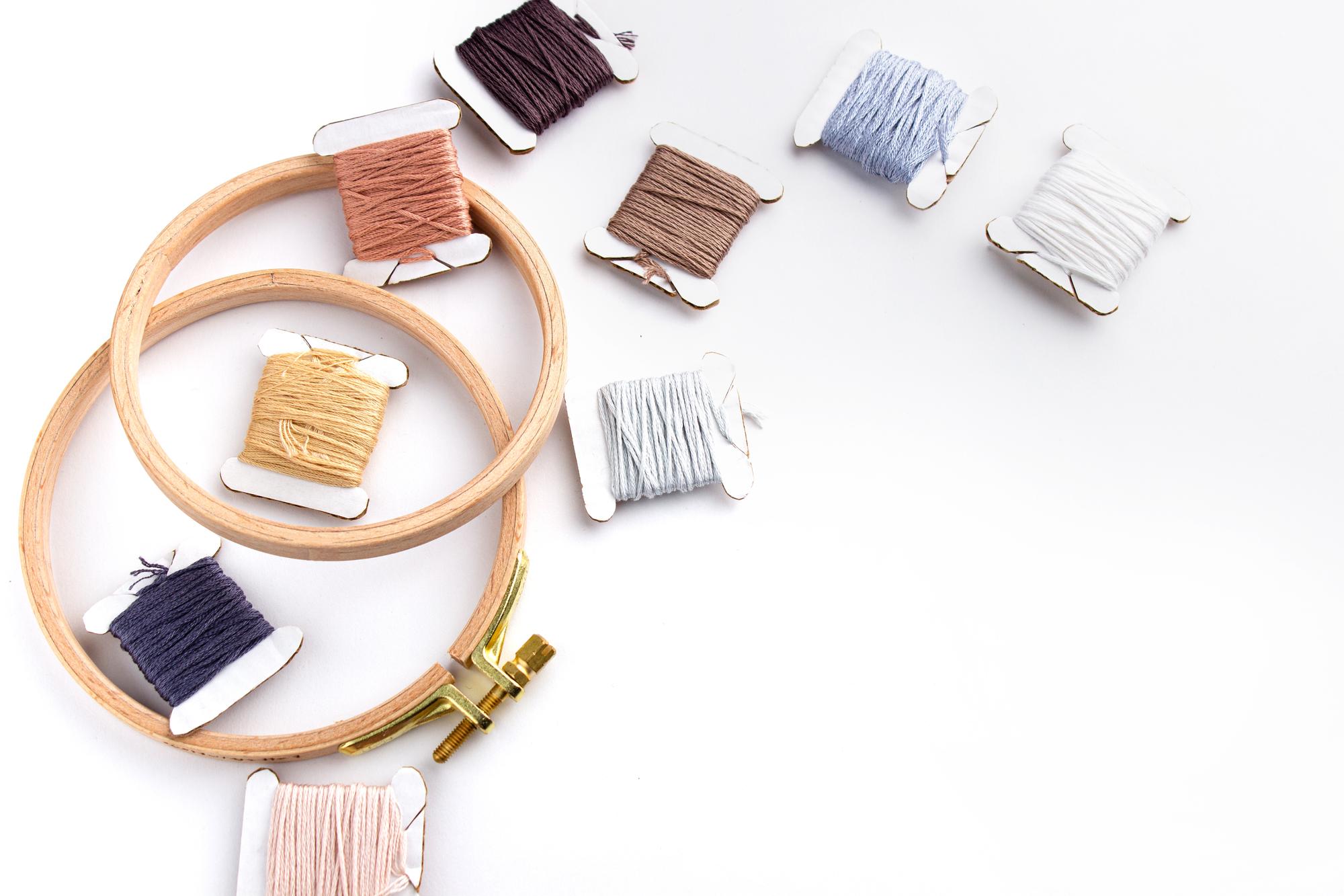 Array of embroidered swatches on table